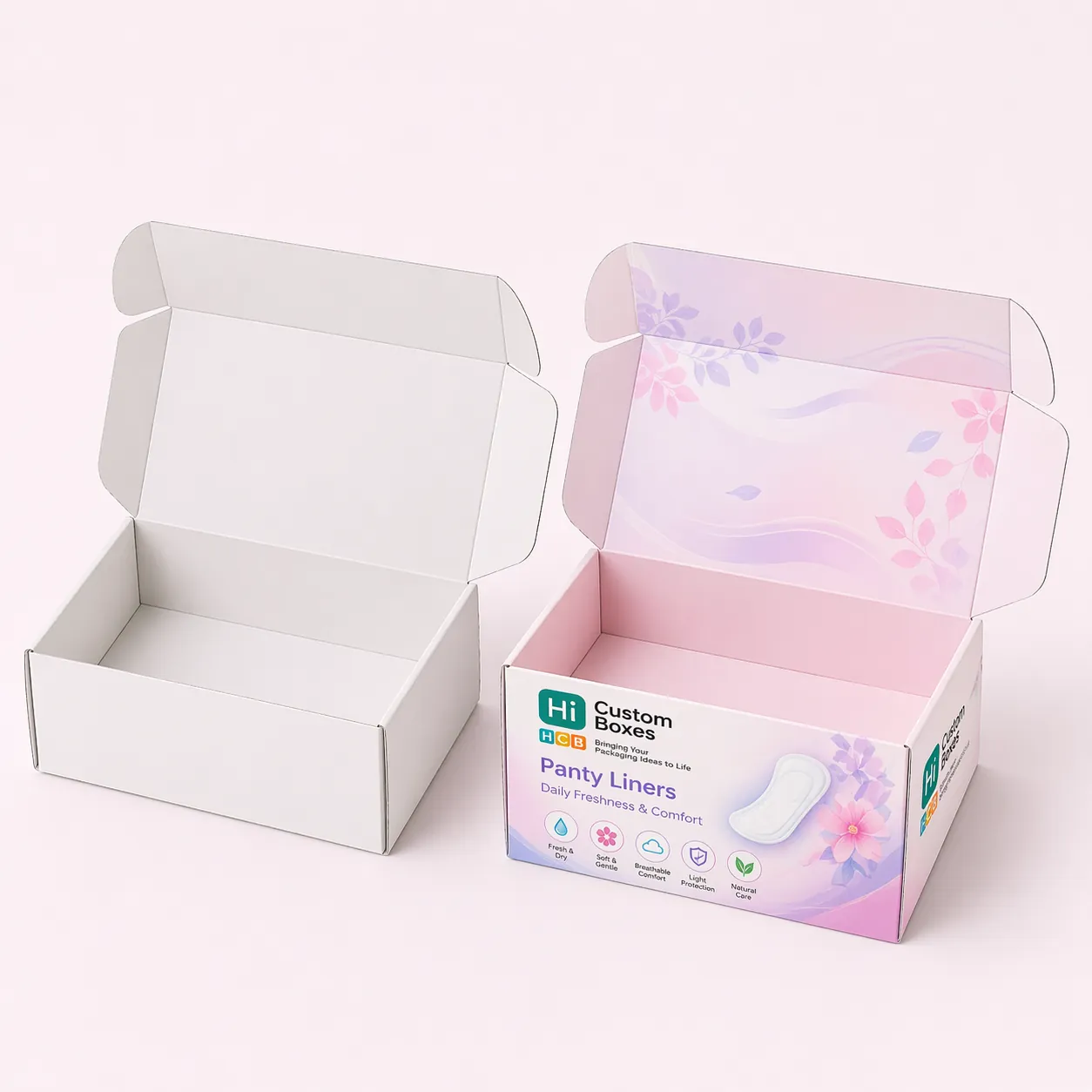 A plain white retail box next to a purple floral branded box for soft panty liners. class=